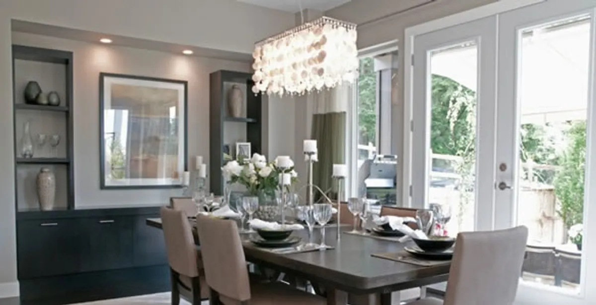 Elegant dining room chandelier installation above table in Tacoma, WA