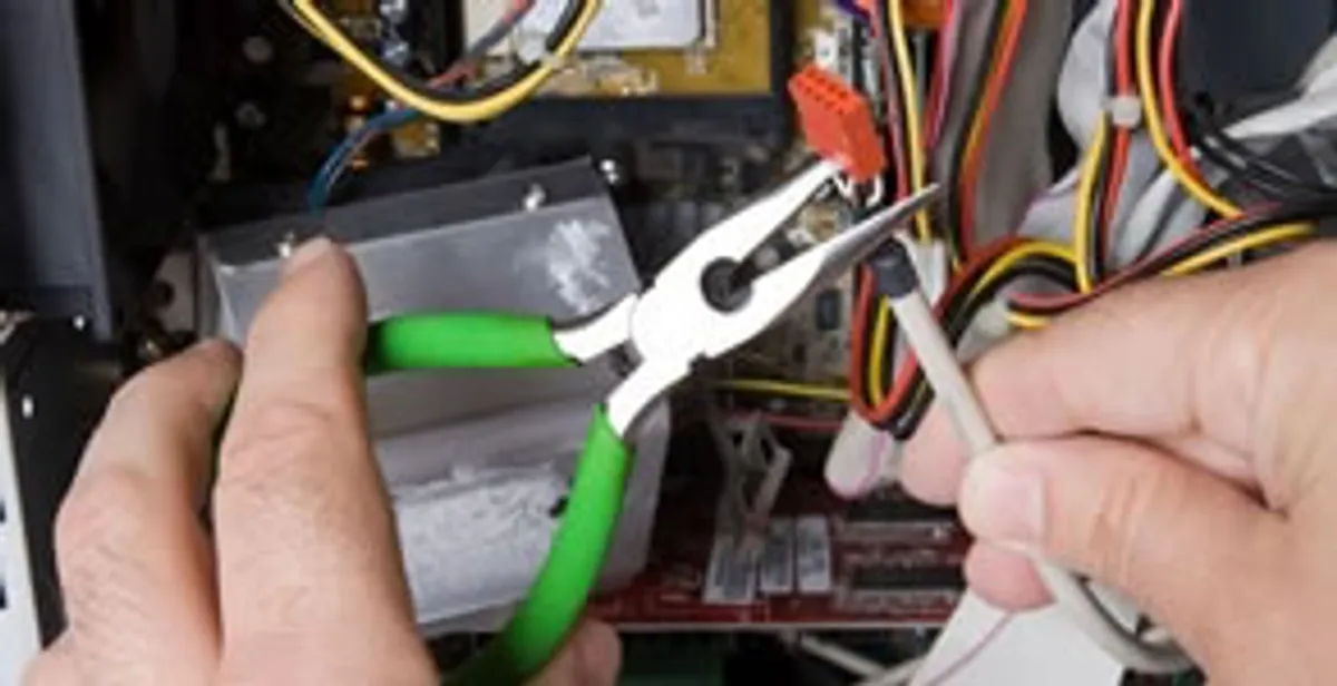 Licensed electrical contractor performing electrical repair with tools in Fox Island, WA